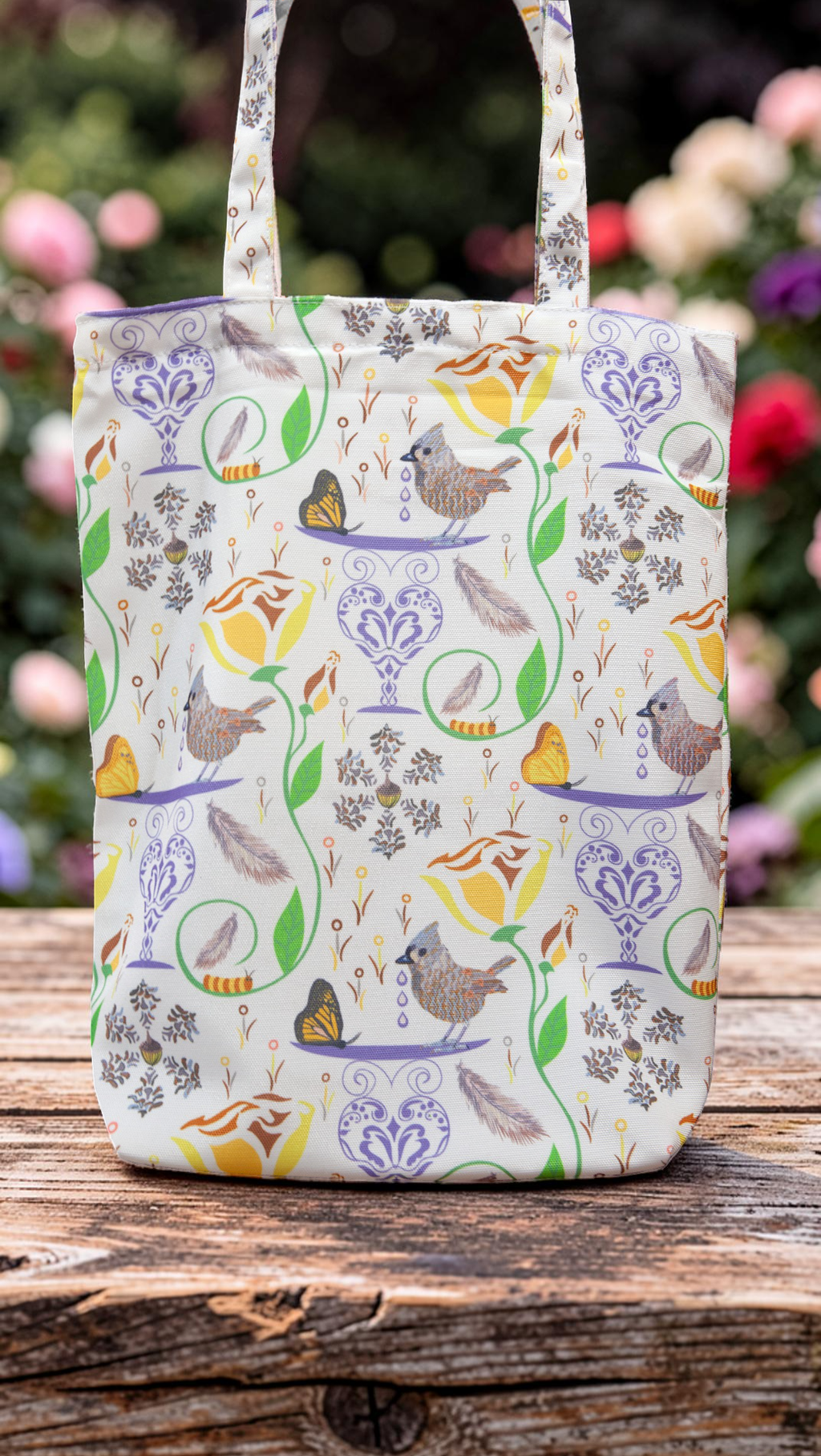 100% recycled plastic bag with a repeat design of birds, butterfies, flowers, and caterpillars on a white background.