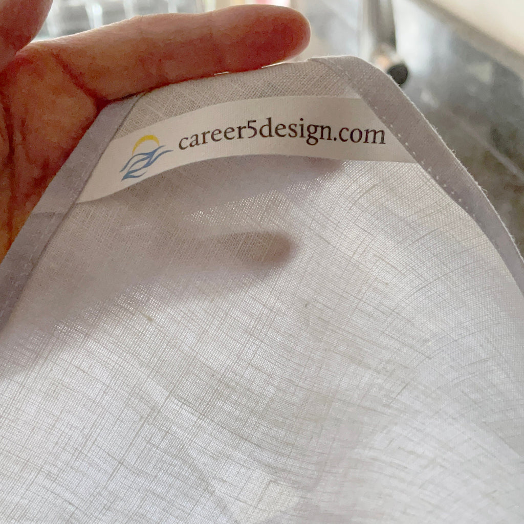 Hang loop on tea towel reads "career5design.com".
