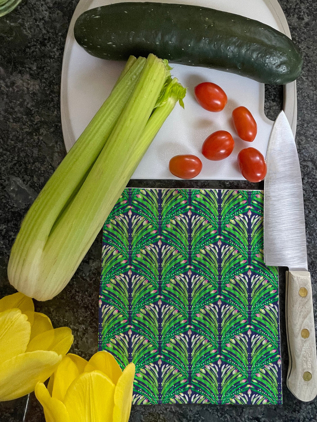Green, yellow, and pink floral pattern printed on a Swedish dishcloth. Compostable cloth is made from 70% cellulose and 30% repurposed cotton.